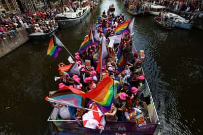 Image for Amsterdam Pride parade blends celebration and protest in LGBTQ+ show of solidarity