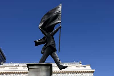Image for Banksy installs statue of flag-wielding man in central London