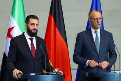 Image for Germany's Merz says Berlin will work with Syria to return refugees