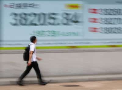 Image for Stocks mostly flat but earnings a positive; gold drops 5%