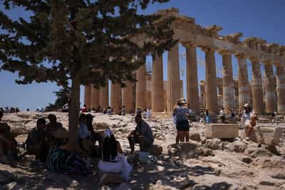 Image for Tourists and residents seek shade as temperatures soar in Athens
