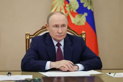 Image for Putin says Russia is curbing economic growth to control inflation, recession 'far away'