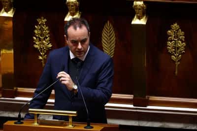Image for French PM forces part of budget bill through lower house without vote