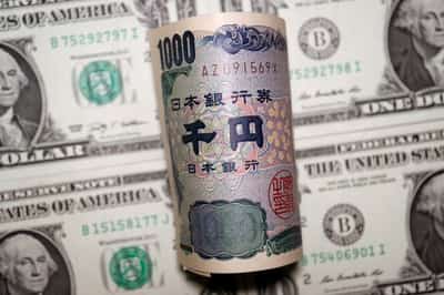 Image for Dollar firms, yen under pressure ahead of Japan's elections