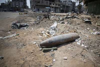 Image for Clearing Gaza's surface of bombs will take up to 30 years, aid group says
