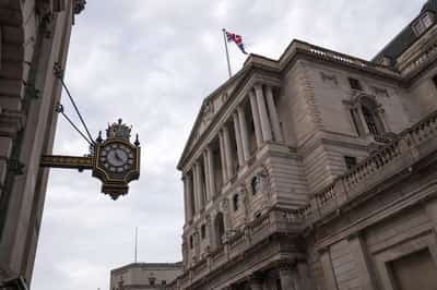Image for Bank of England leaves rates steady after tight vote, sterling falls