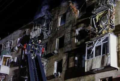 Image for Drone hits apartment building in Ukraine's Kharkiv, injures seven, mayor says