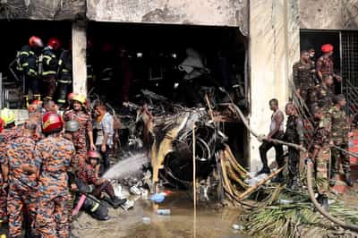 Image for Teacher dies saving students from inferno in Bangladesh jet crash