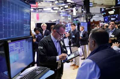 Image for S&P 500 briefly tops 7,000 before pullback as Fed, Big Tech earnings loom