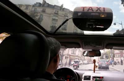 Image for French taxi protests test PM's budget-cutting resolve