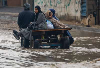 Image for Torrential rain flooded Gaza tents and a baby died of exposure, medics say