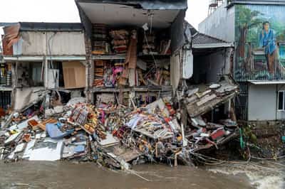 Image for Bali floods kill 14, search continues for two missing