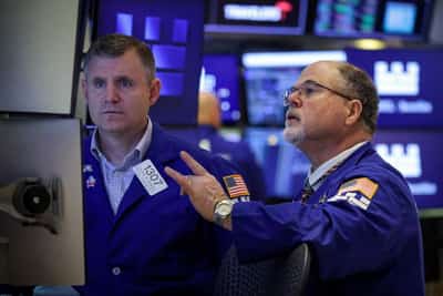 Image for US stocks lose ground, gold resumes its climb as risk appetite sours