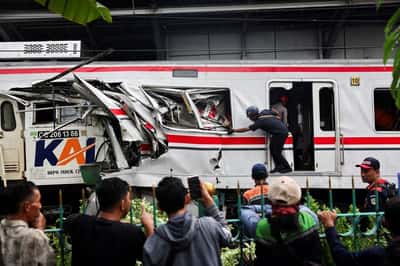 Image for Indonesia commuter train crash toll rises to 14 as rescuers complete evacuation