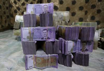 Image for Exclusive-Syria to revalue currency, dropping two zeros in bid for stability
