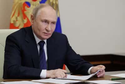 Image for Putin says Russia plans to cut military spending from next year