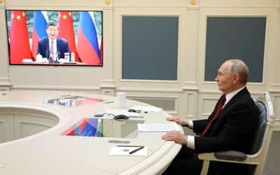 Image for Xi, Putin hail ties in video call as Ukraine war nears anniversary