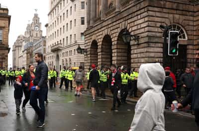 Image for Car ploughs into fans at Liverpool parade, 27 in hospital