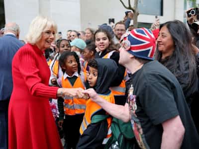 Image for Queen Camilla visits poppy memorial for Victory in Europe Day celebrations