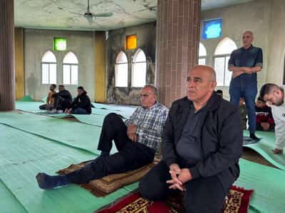 Image for Palestinians return for prayers in West Bank mosque after settler attack