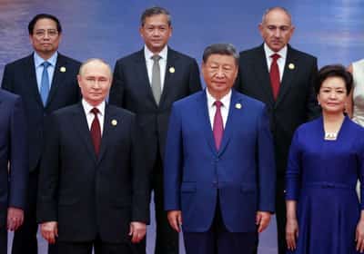 Image for China's Xi pushes a new global order, flanked by leaders of Russia and India