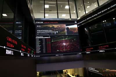 Image for London's FTSE 100 edges lower as utilities and miners weigh