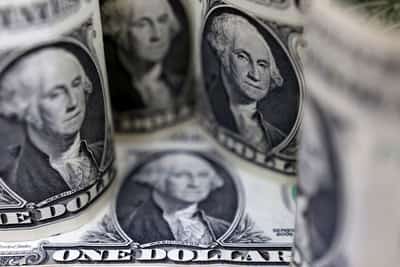 Image for Dollar tumbles, traders bet on more US rate cuts after weak jobs report