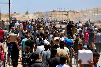 Image for Aid trucks move from Egypt to Gaza after Israel said it began airdrops