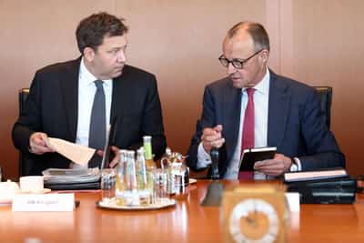 Image for German finance minister says oil companies must do their part to lower fuel costs