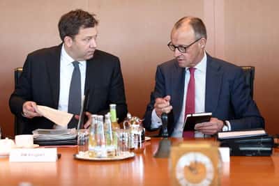 Image for German finance minister says oil companies must do their part to lower fuel costs