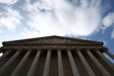 Image for French lawmakers adopt tax hikes on global firms amid volatile budget talks